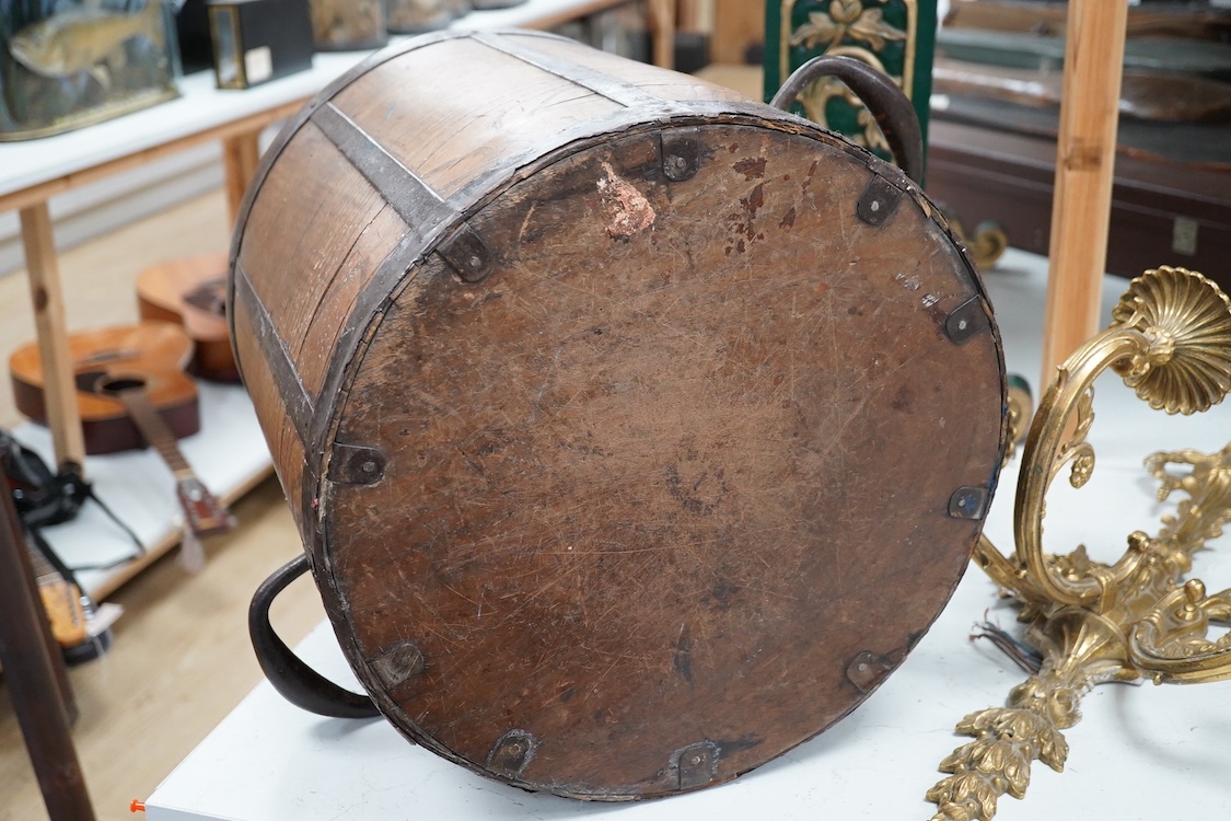 A Georgian iron framed oak Bushel measure, stamped with ‘BUSHEL’ and a crowned GR, diameter 36cm, height 38.5cm